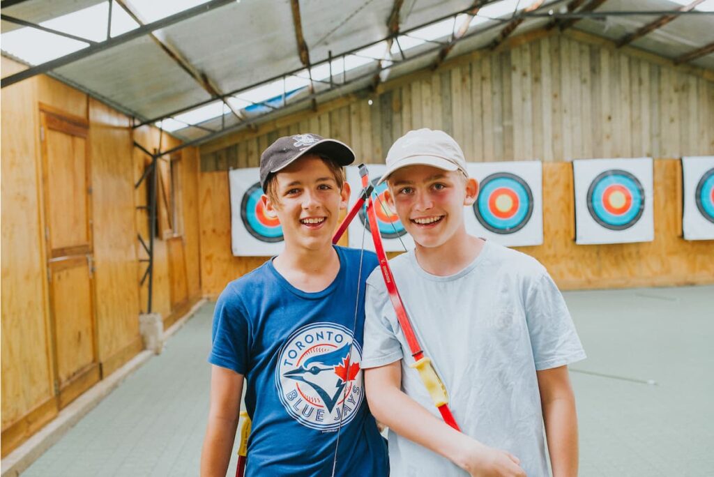 Kids archery at youth camp.